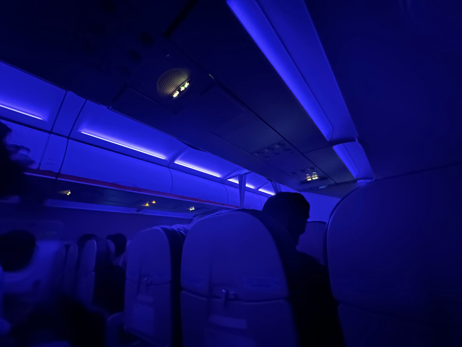 The dark moody interior of an airplane