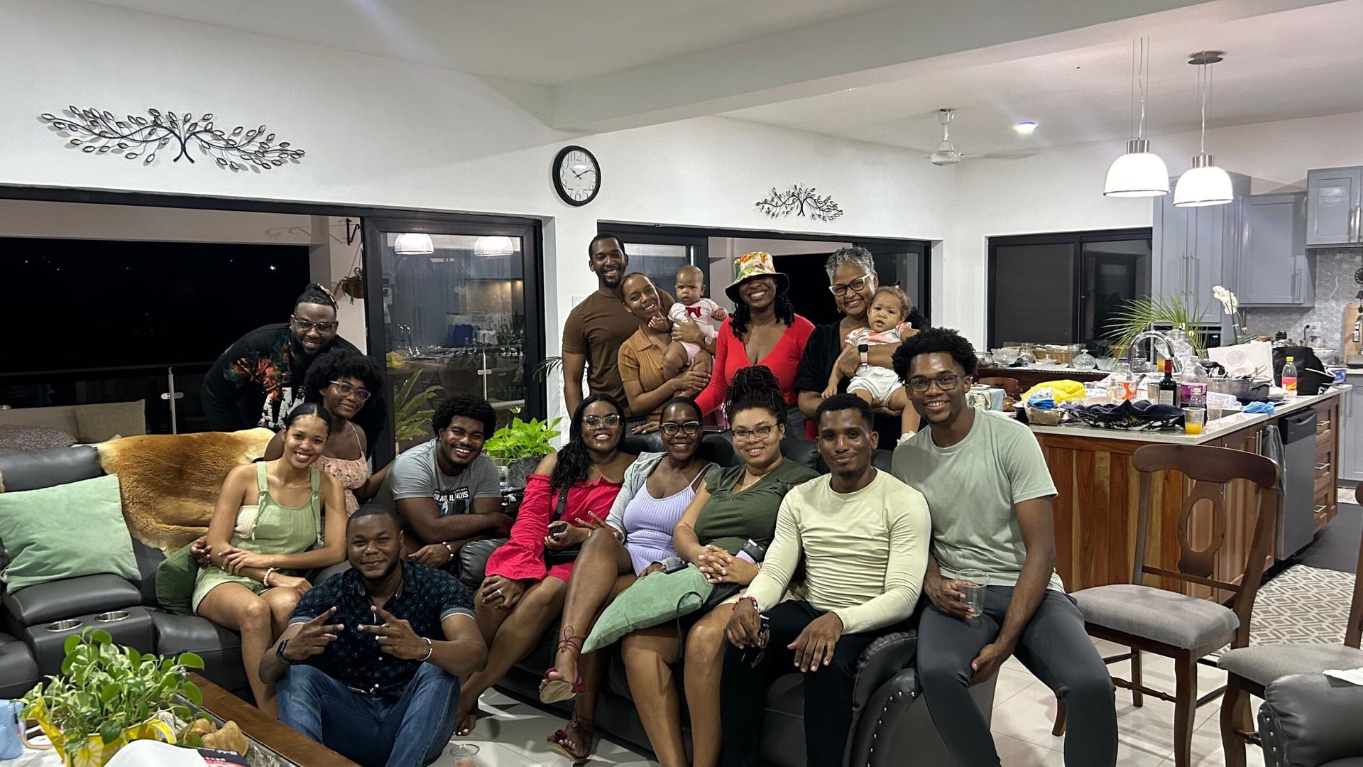 Picture of Joshua and his friends in his living room in Jamaica. 