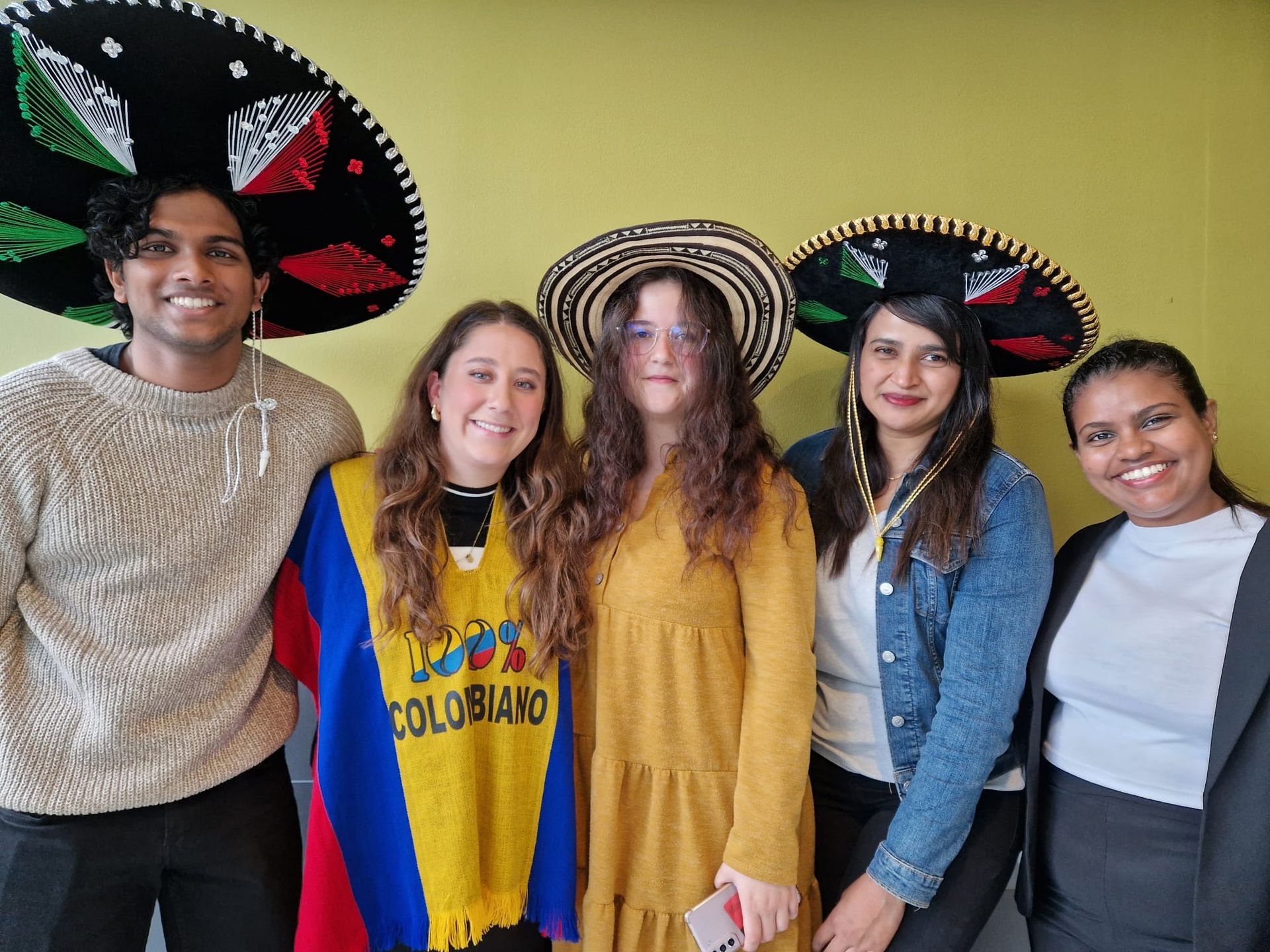 5 students wearing different cultural clothing