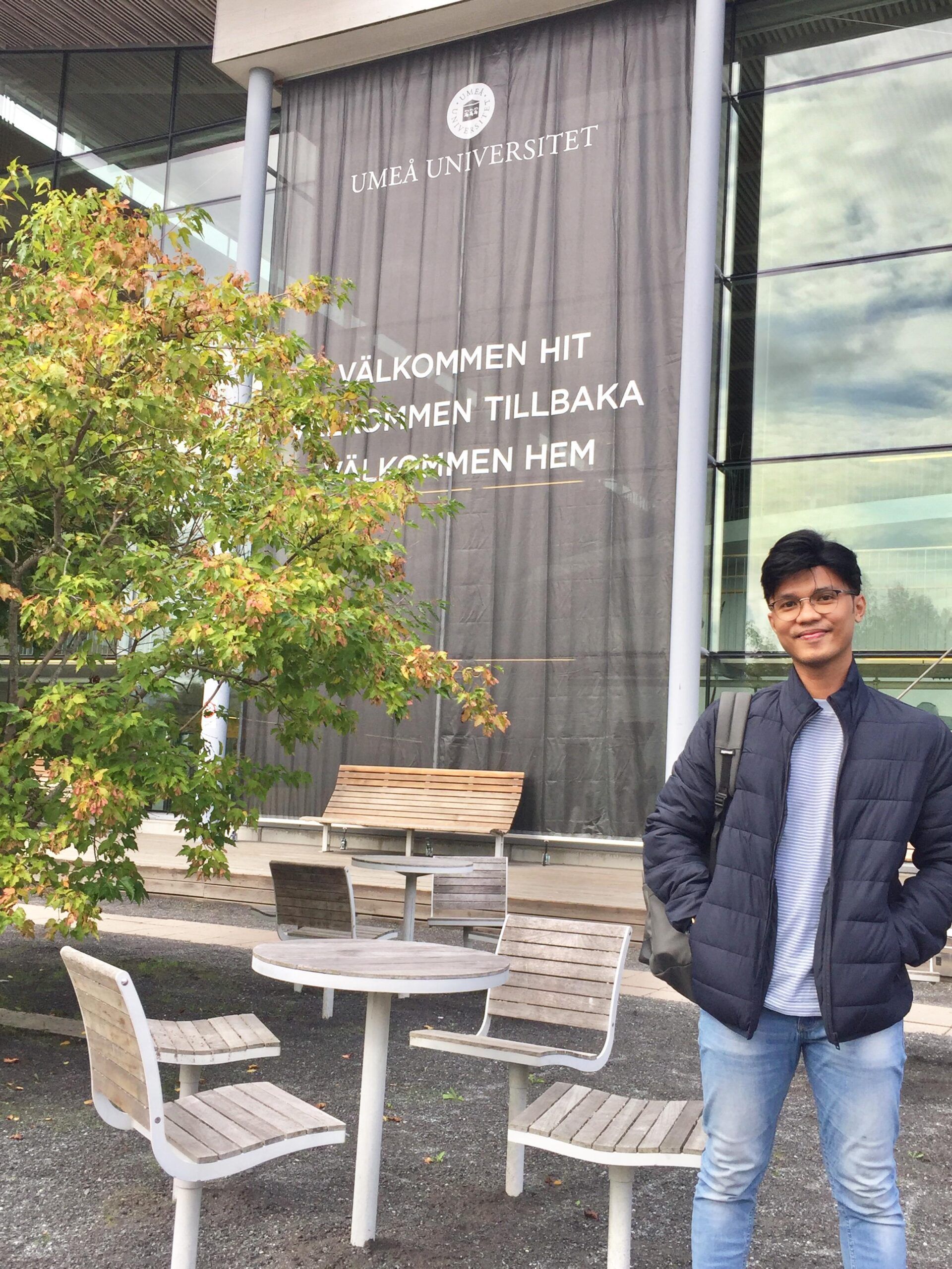 a bit standing in front of a university building