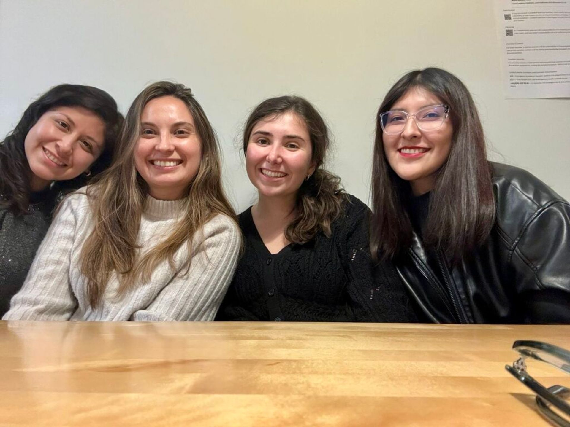 Four women smiling at the camera.