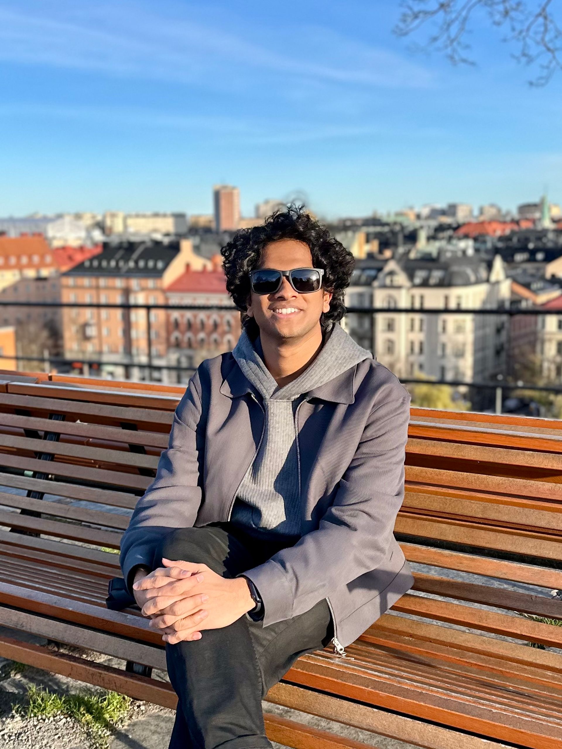 a boy sitting on a bench in Stockholm city