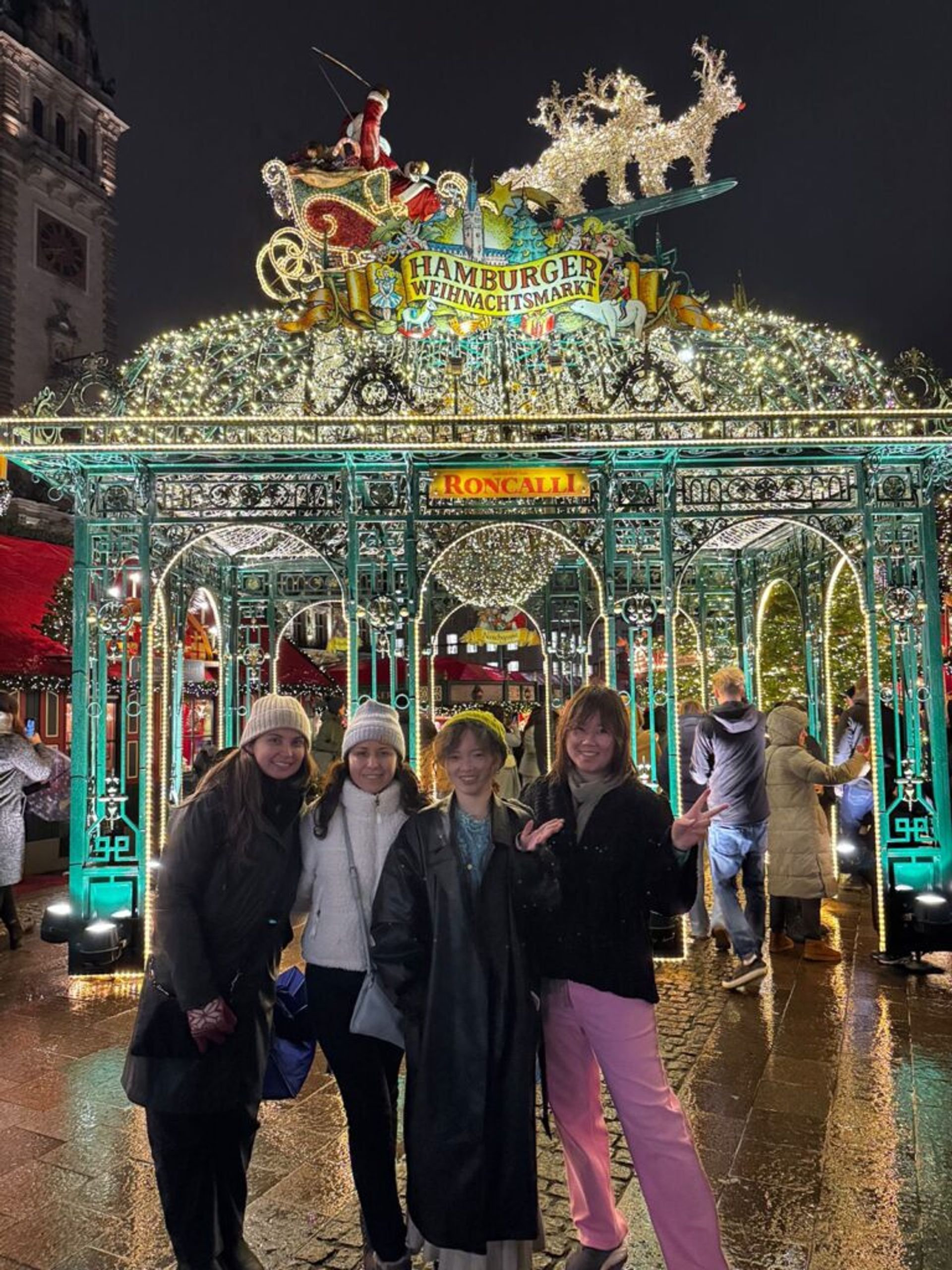 Four girls smiling to the camera 