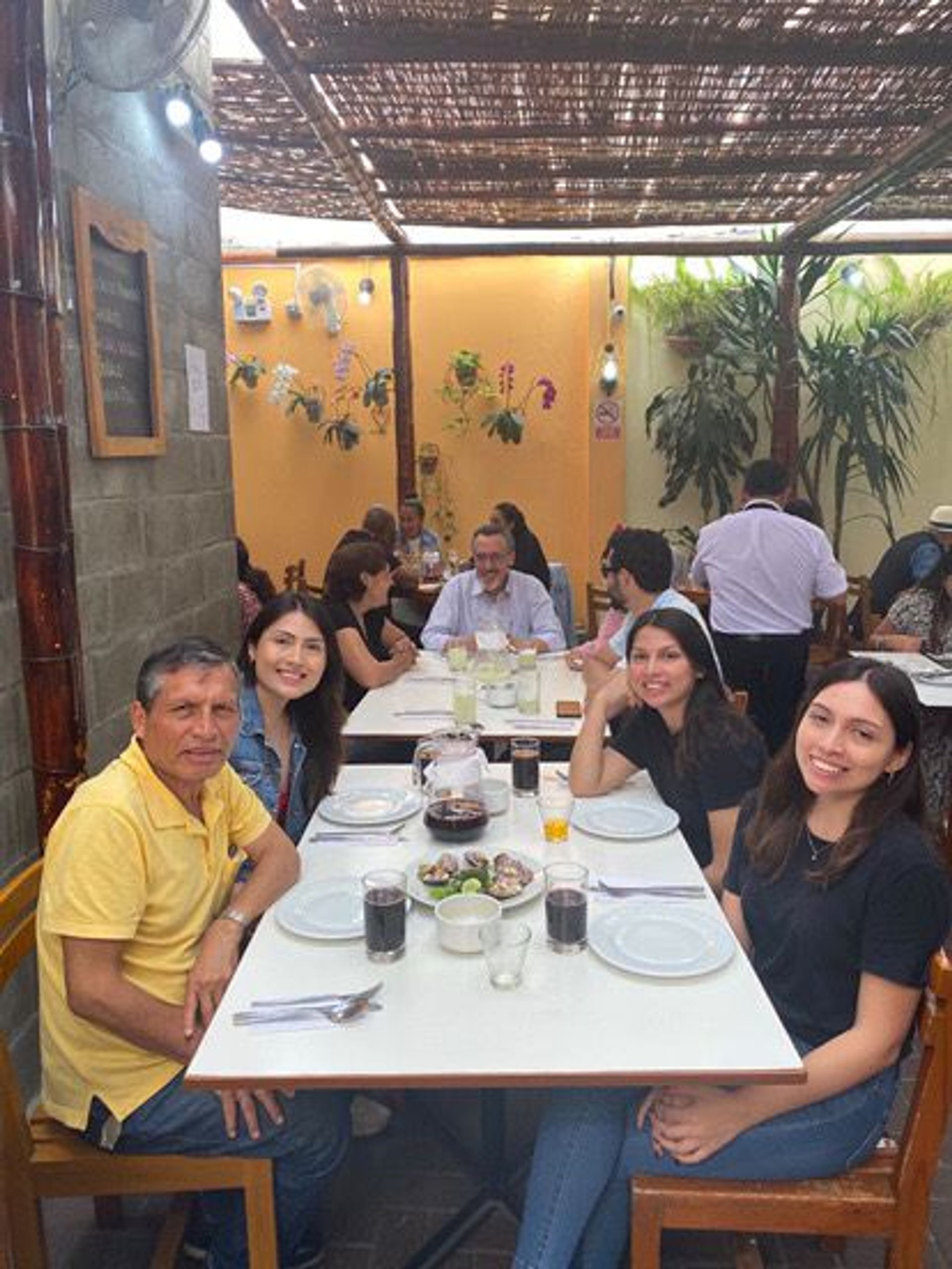 A family eating at a peruvian restaurant in Lima.