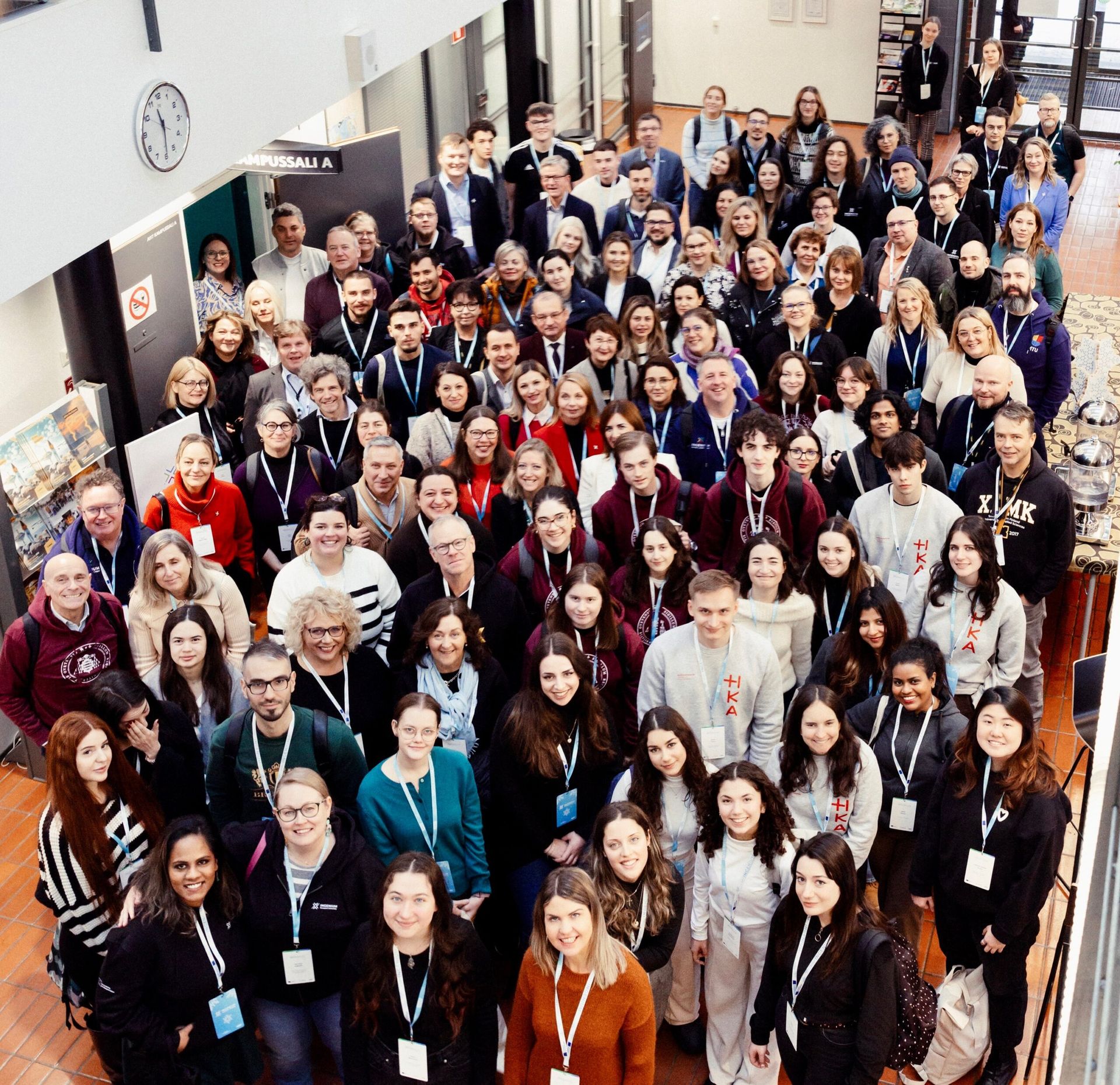 a portrait of a group of students inside a building