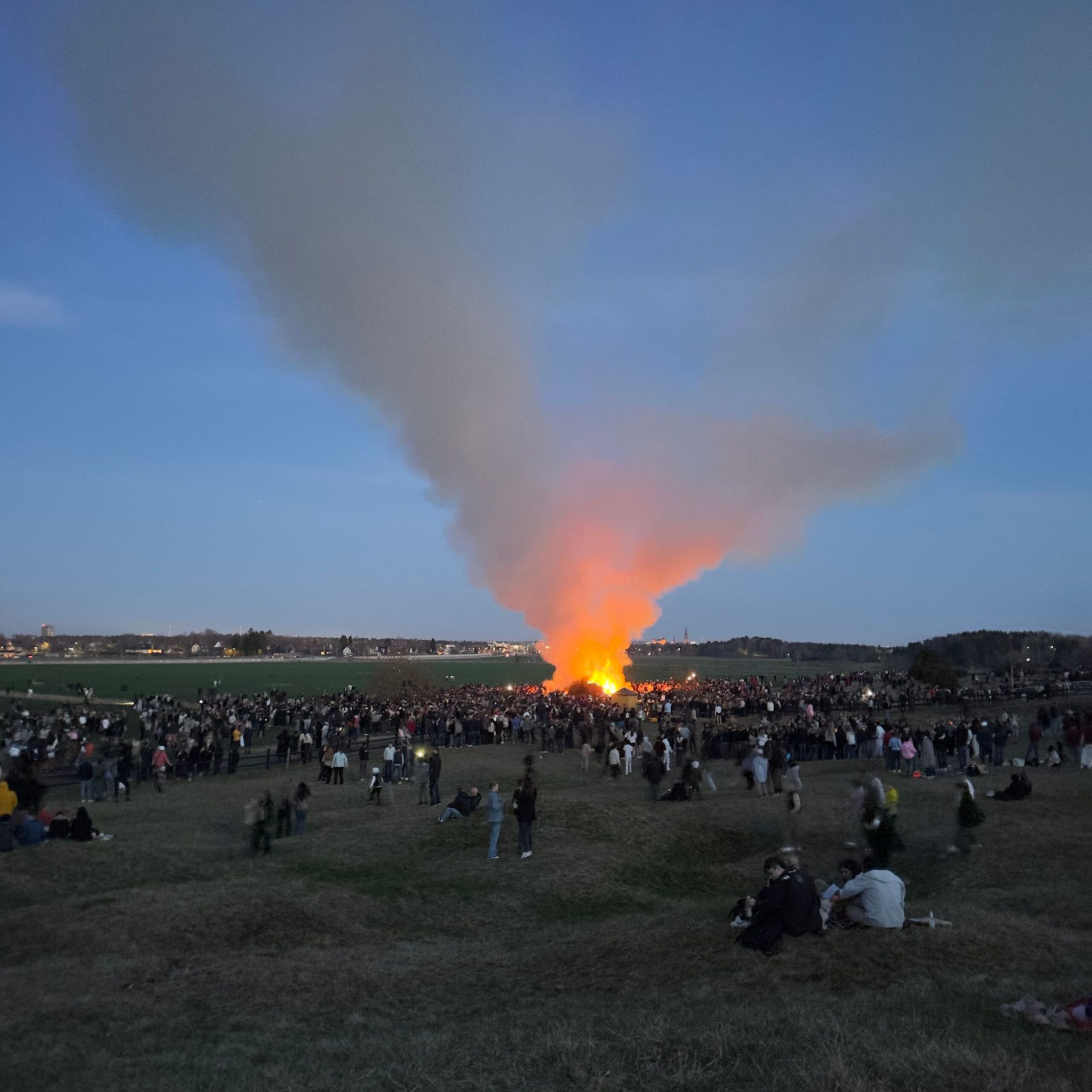 Walpurgis Night at Uppsala, with a crowd surrounding a large fire