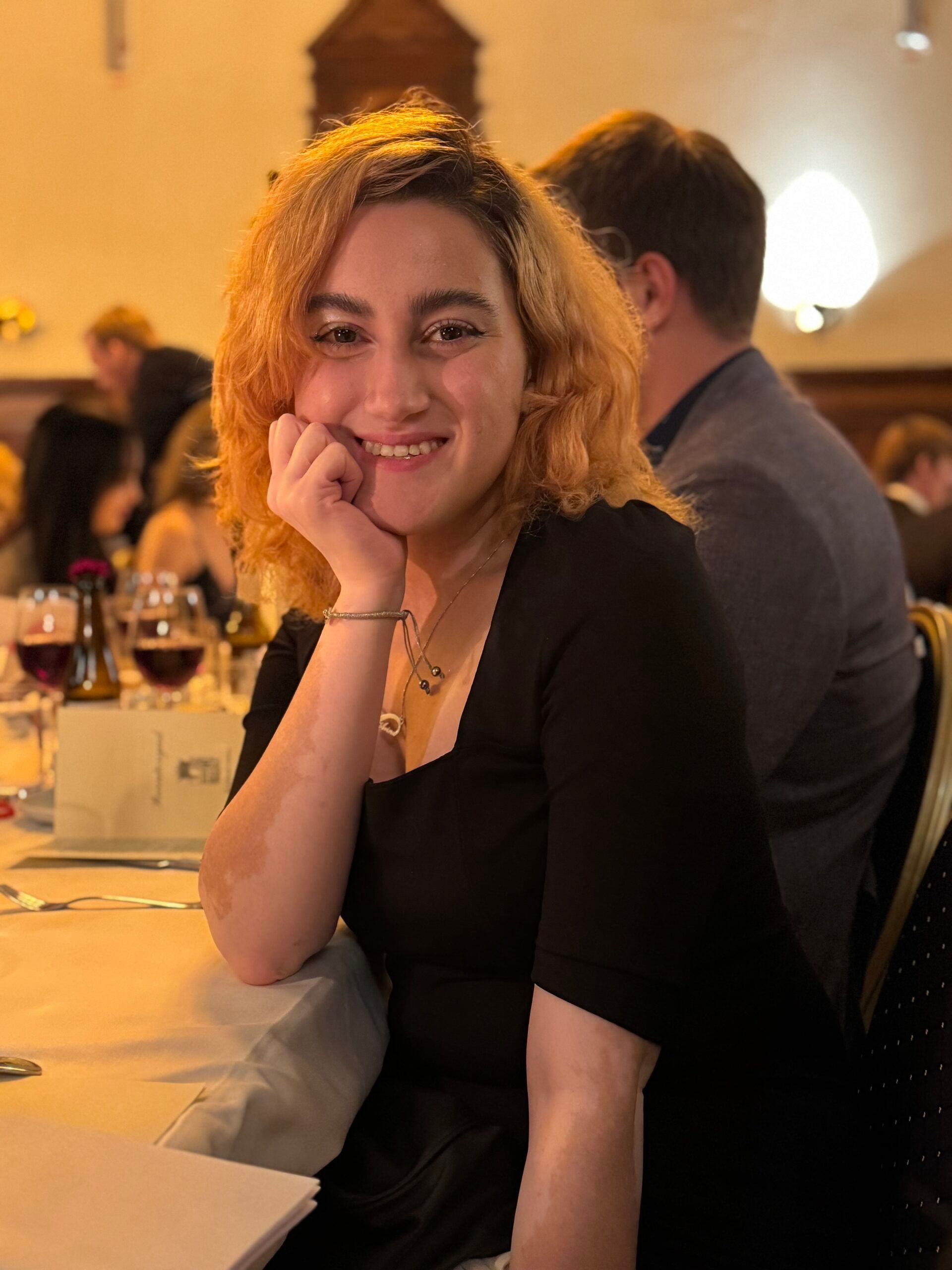 A girl posing at a formal event