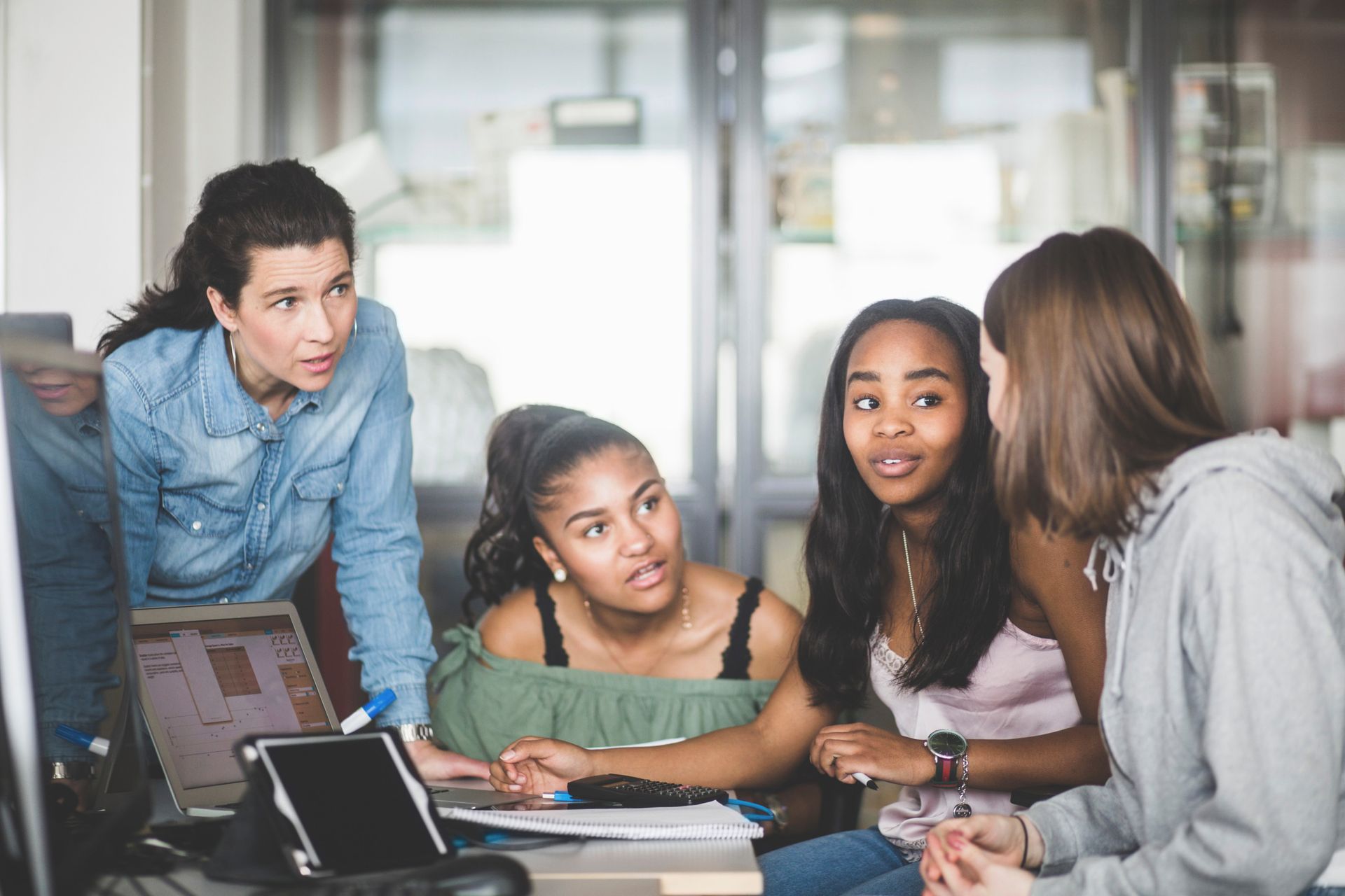 four people talking 