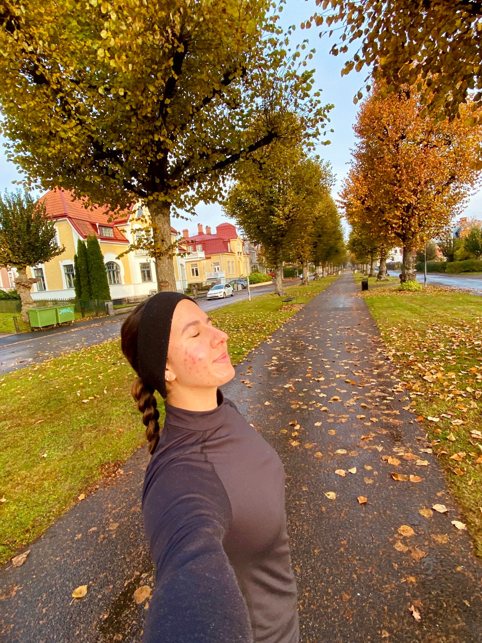 A girl stopping for a deep breath during an outdoor run