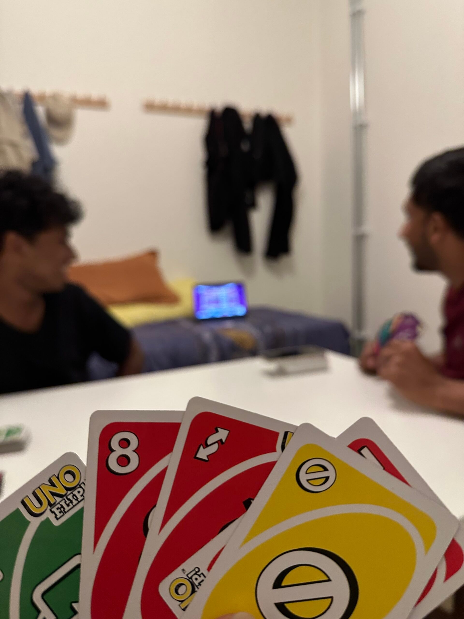 a hand of uno cards