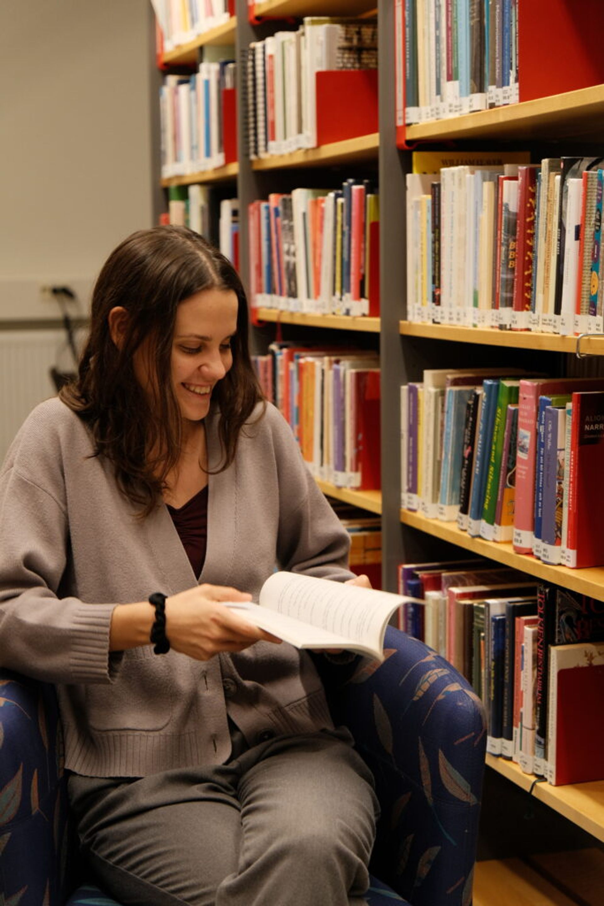A girl reading in a library.