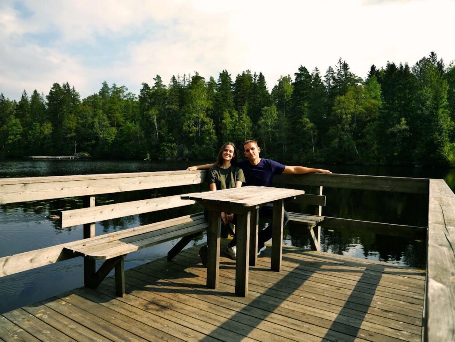 A couple by a lake