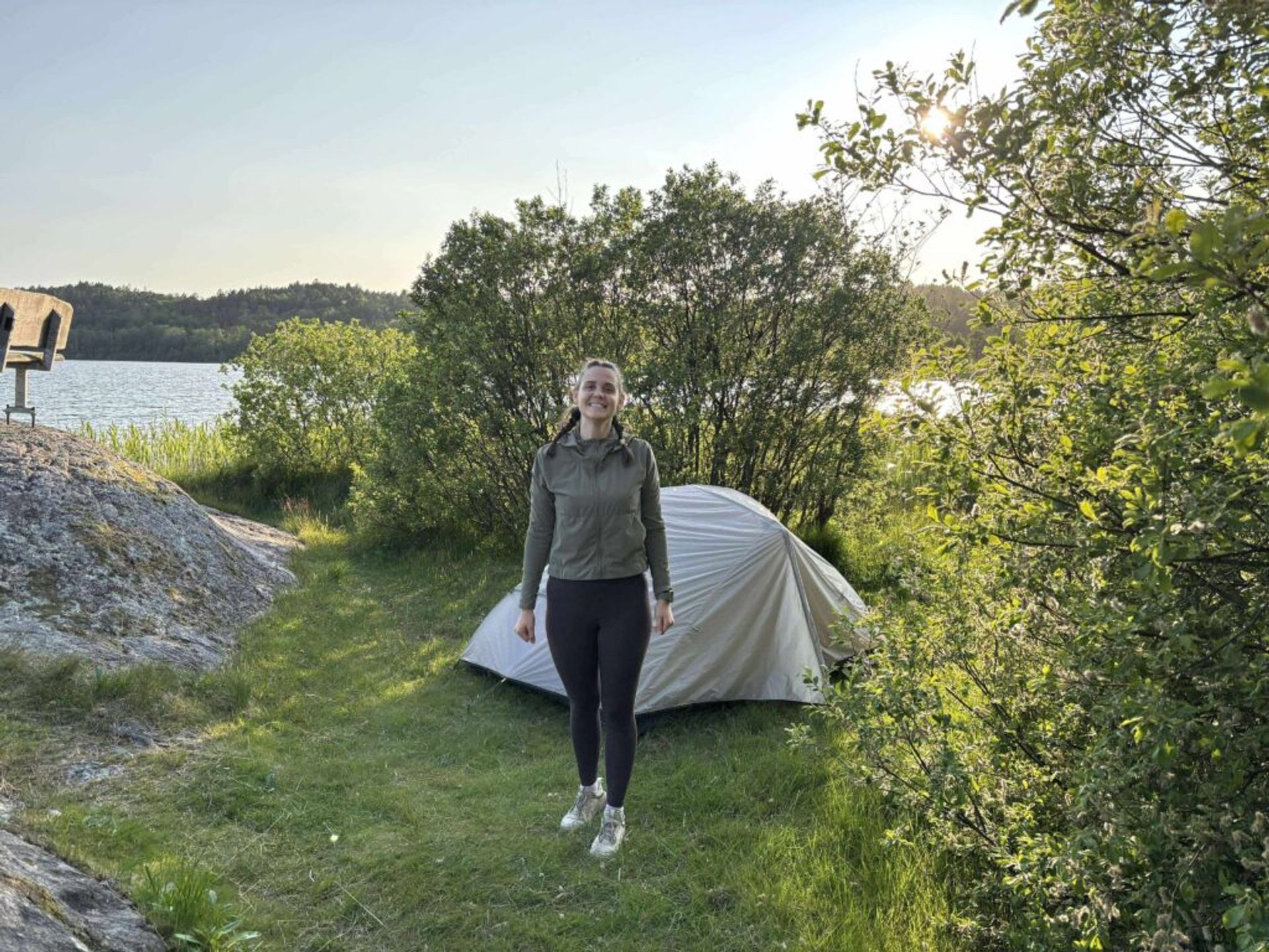 A girl by a tent