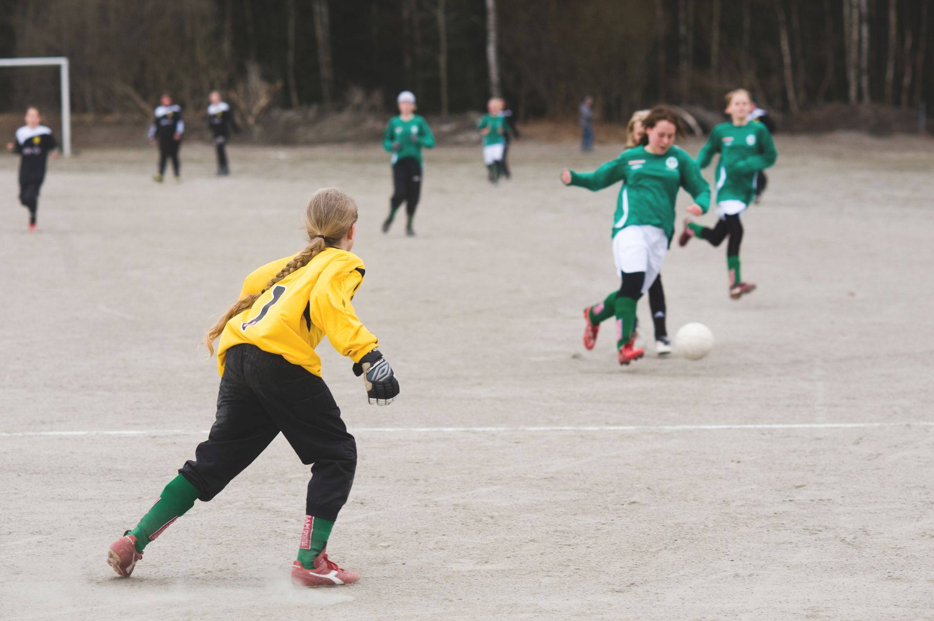 A group of teens playing football