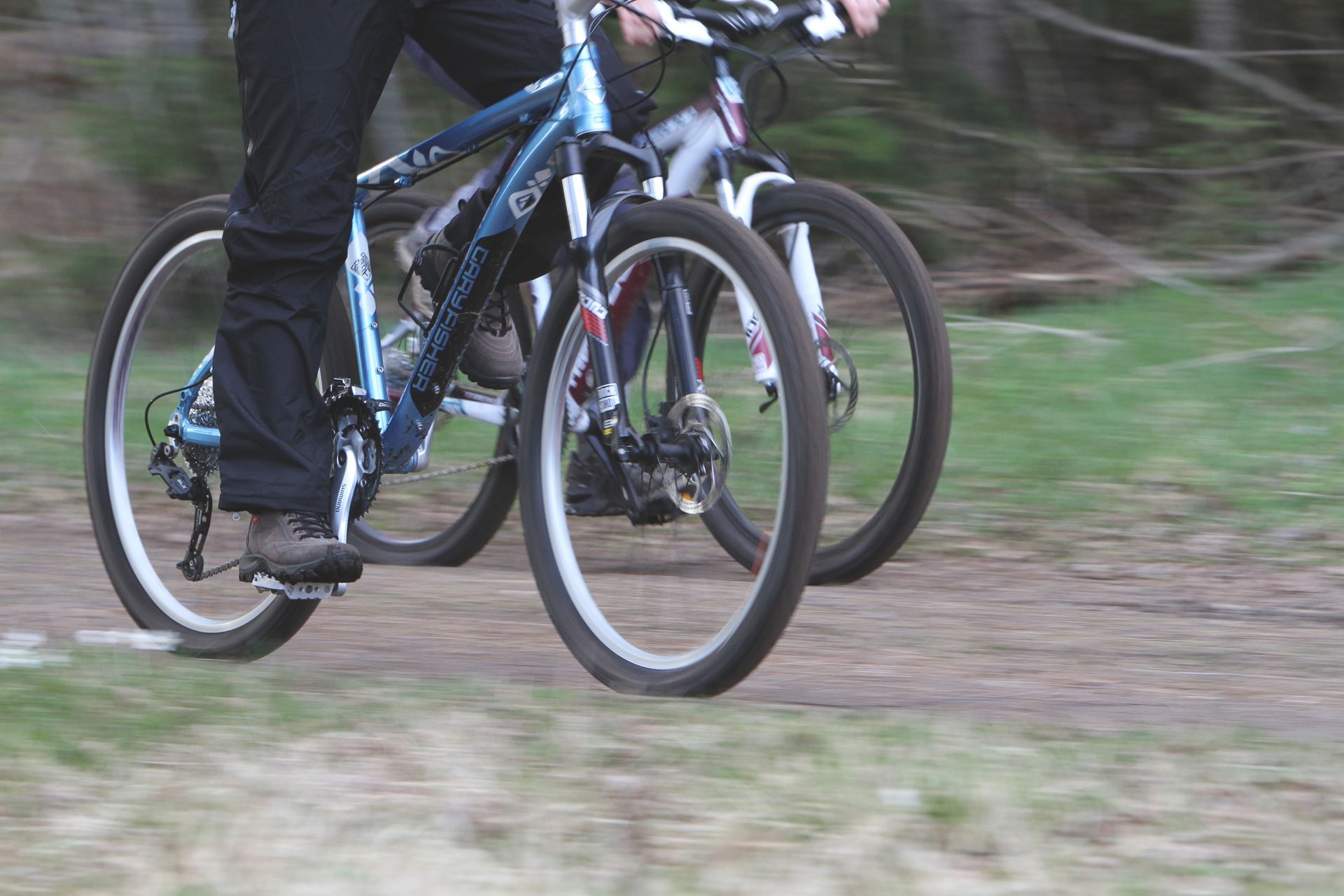 Two cycles going off road biking