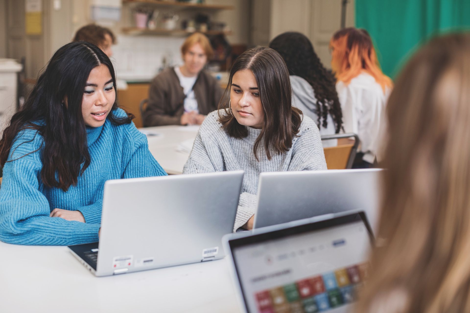 Two students on their laptops