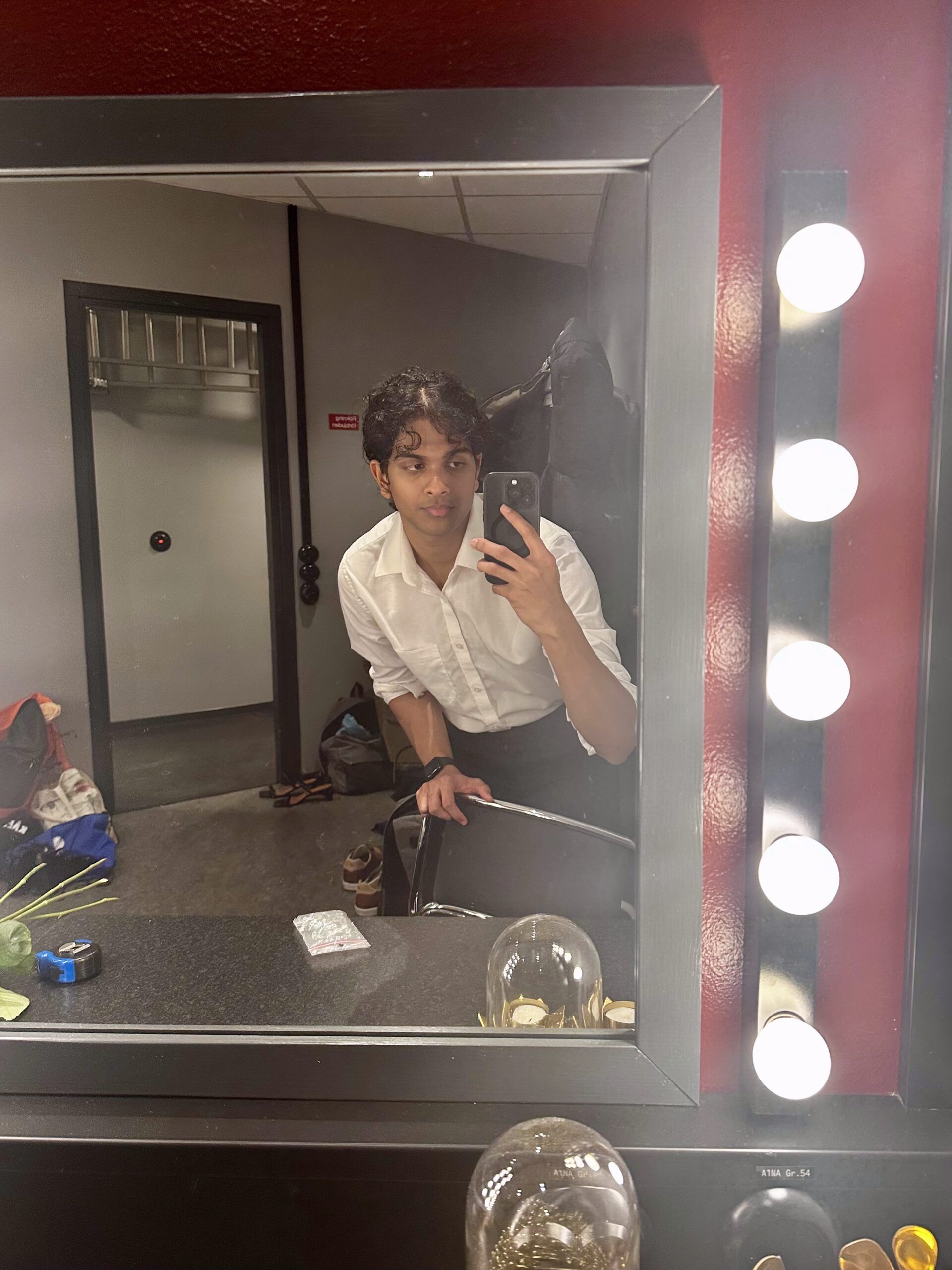 a selfie of a student working during graduation with their sleeves rolled up